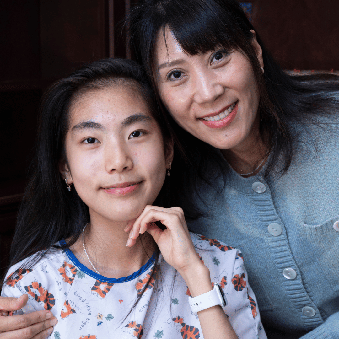 Mother and daughter holding each other