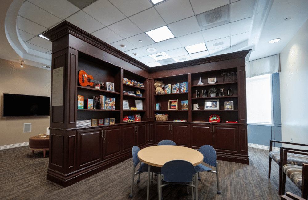 Room with bookcase and table at rady children's hospital at mission