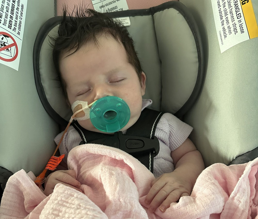 baby sleeping with medical support