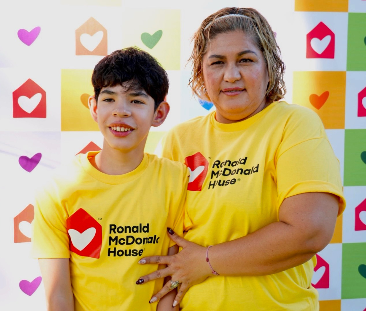 mother and son wearing Ronald McDonald House t-shirts