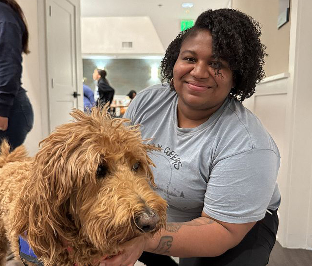 Jerrette with a service dog
