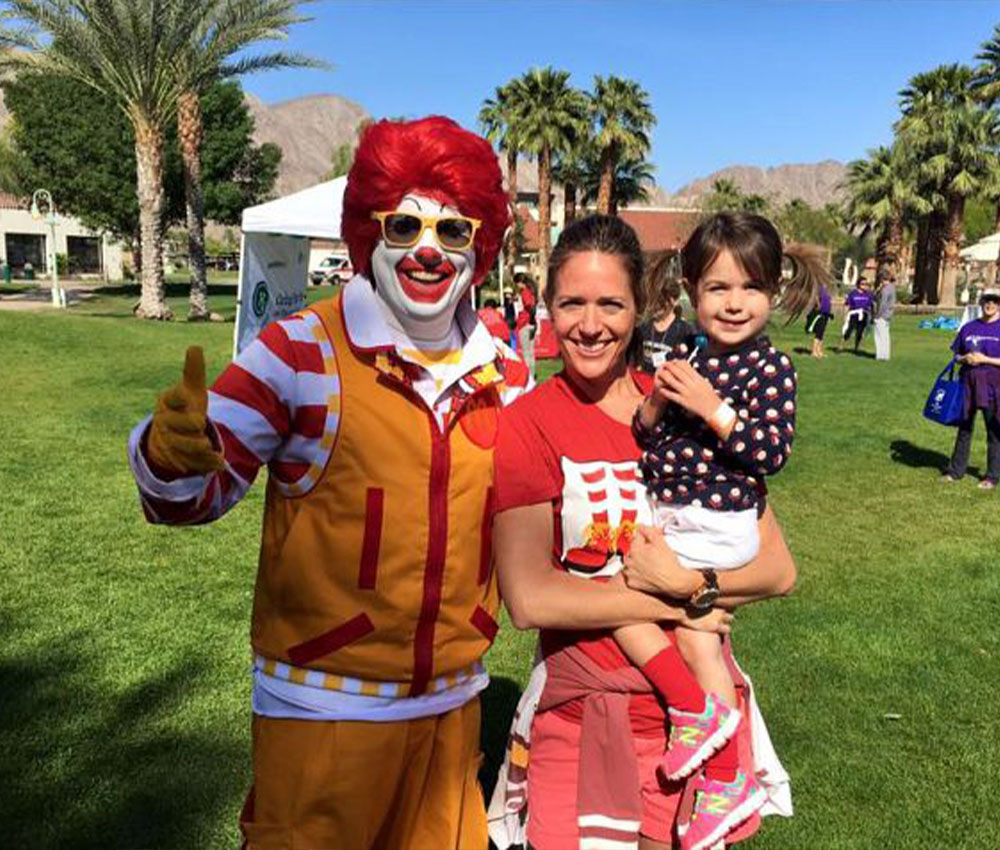 Ronald McDonald character with Brooke family